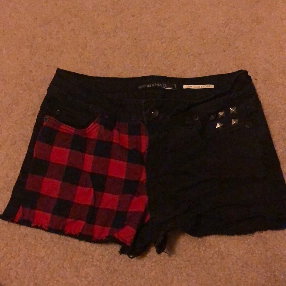 Red and black patterned and studded jean shorts